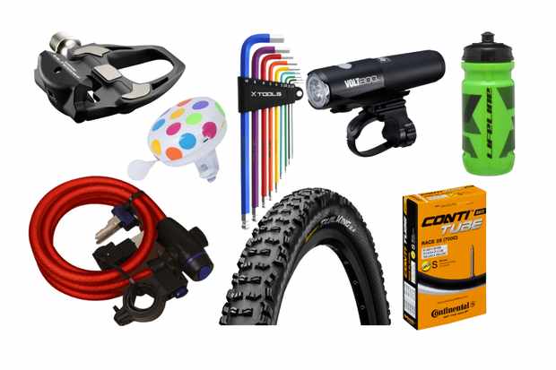 Collage of a range of cycling accessories on a white background, including a pedal, light, colourful Allen key set, bell, lock, tyre, inner tube in a box and a light
