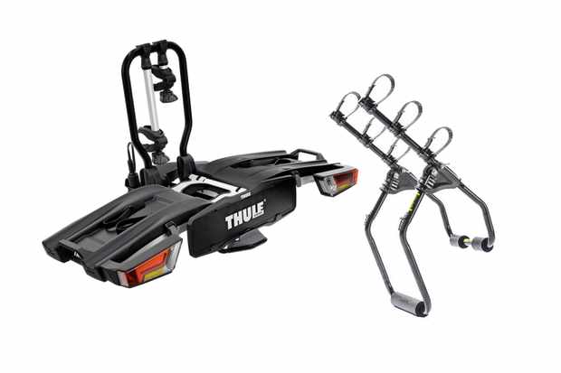 A photo of two bike racks for cars on a plain white background