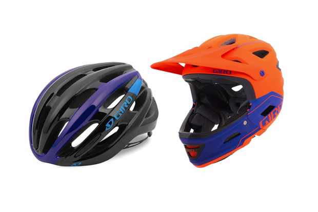 Two bike helmets on a white background