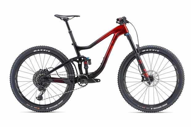 Red and black full suspension mountain bike on a white background