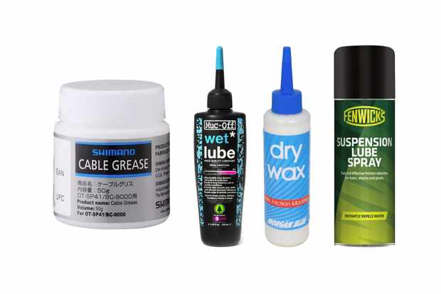 Collage of 4 different containers of bike lubricant on a white background