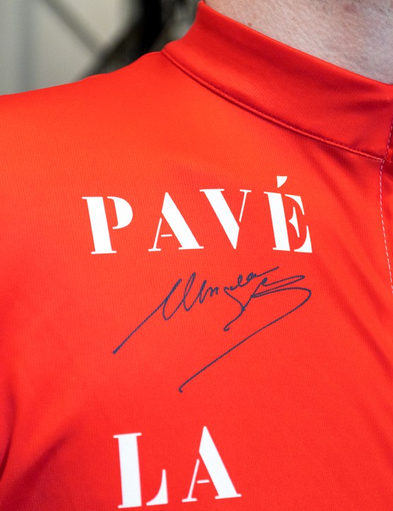 Man wearing Le Col x Lion of Flanders jersey